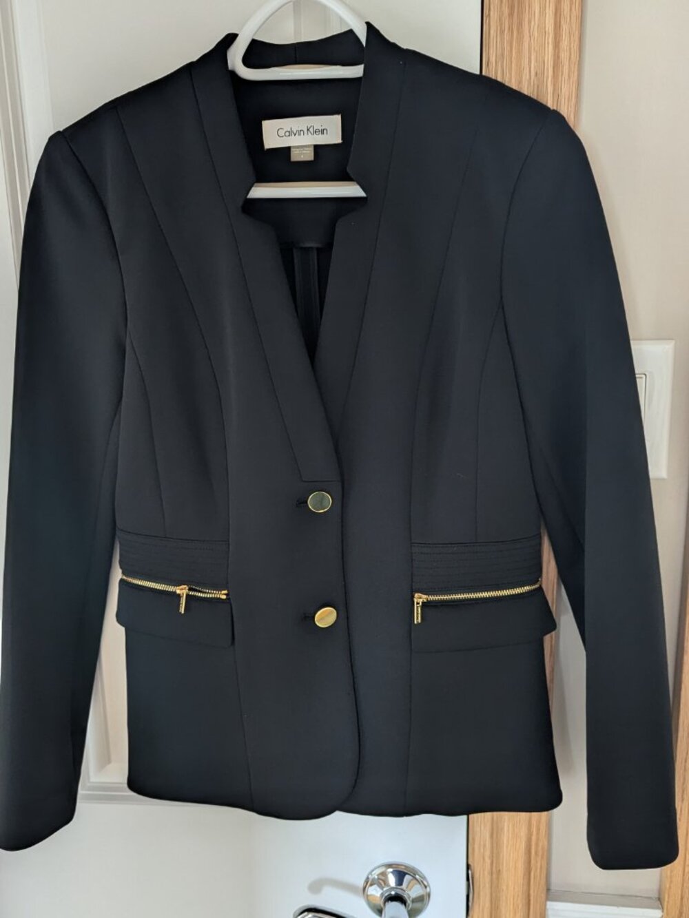 Calvin Klein size 4 black stretch blazer with gold zips and buttons